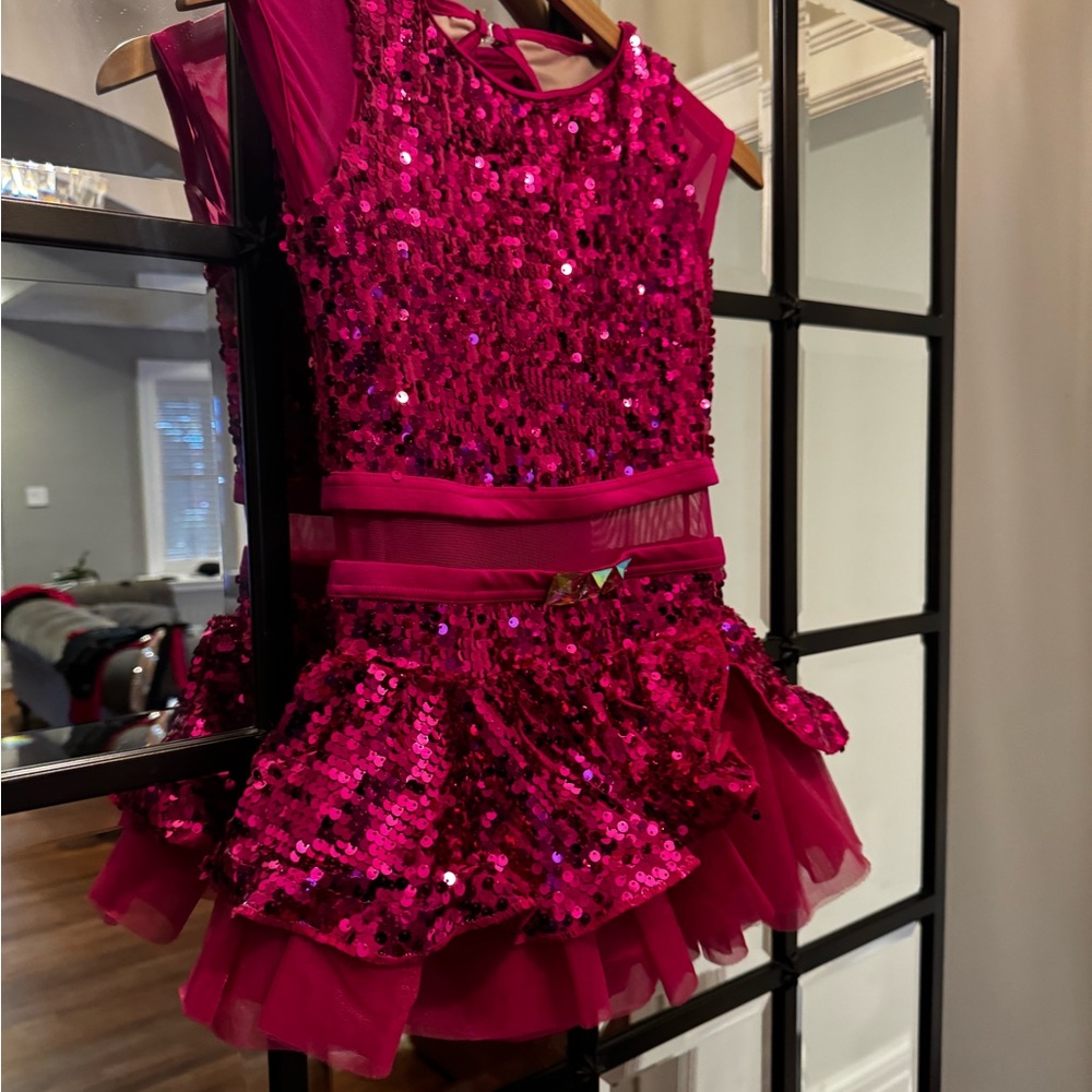 Pink sequin with puff tulle underskirt.
